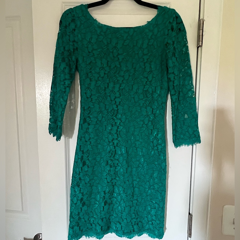 Classic DVF emerald green/teal lace dress with V neck back & gold zipper detail.